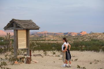 Nancy reads the sign near sunset