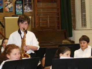 Robert plays the sax in band