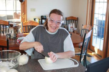 Nancy cuts onions