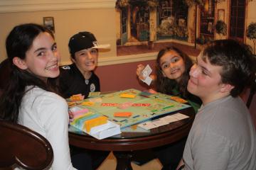 Kids play monopoly